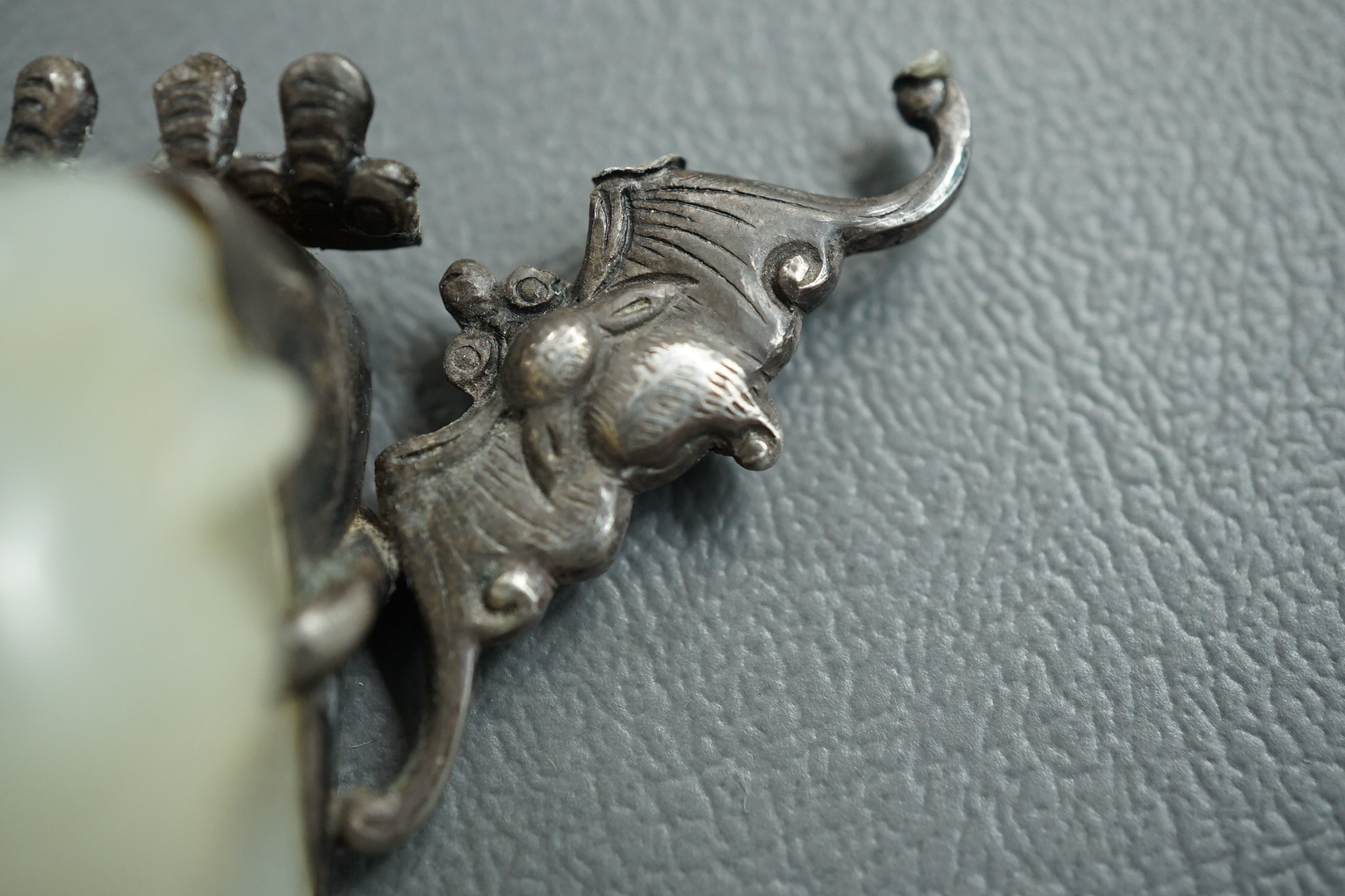 A Chinese jade and cabochon mounted hand mirror, the jade 18th/19th century
